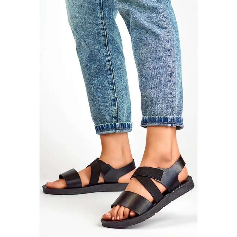 Black elastic sandals with a fitted upper and elastic band