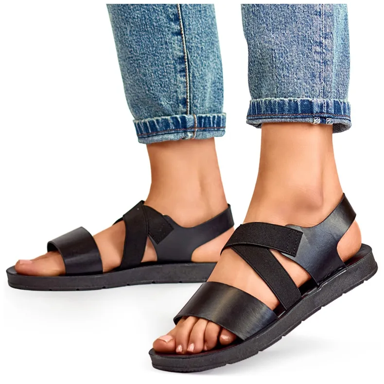 Black elastic sandals with a fitted upper and elastic band