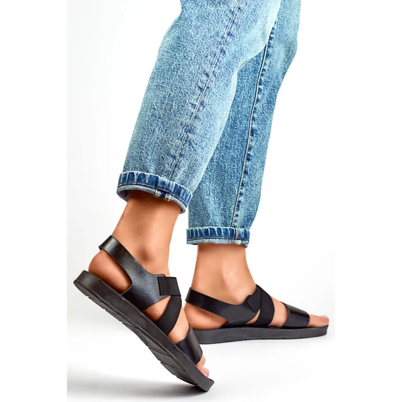 Black elastic sandals with a fitted upper and elastic band